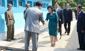 North Korean delegate Kim Song-hye, right, is greeted by a South Korean official in Panmunjom. Photograph: EPA/Ministry of Unification